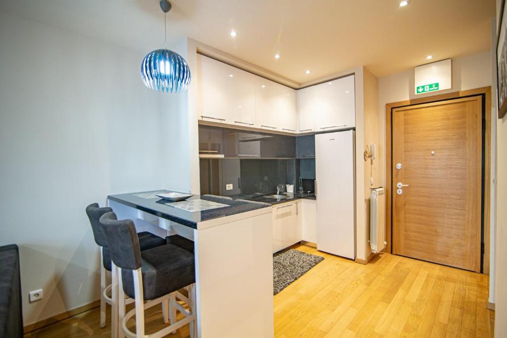 Kuchyň nebo kuchyňský kout v ubytování Apartman Oaza Kalman SPA-GYM