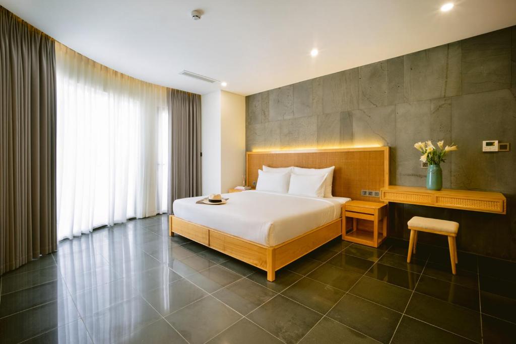 Giường trong phòng chung tại LIVIE Da Nang An Thuong