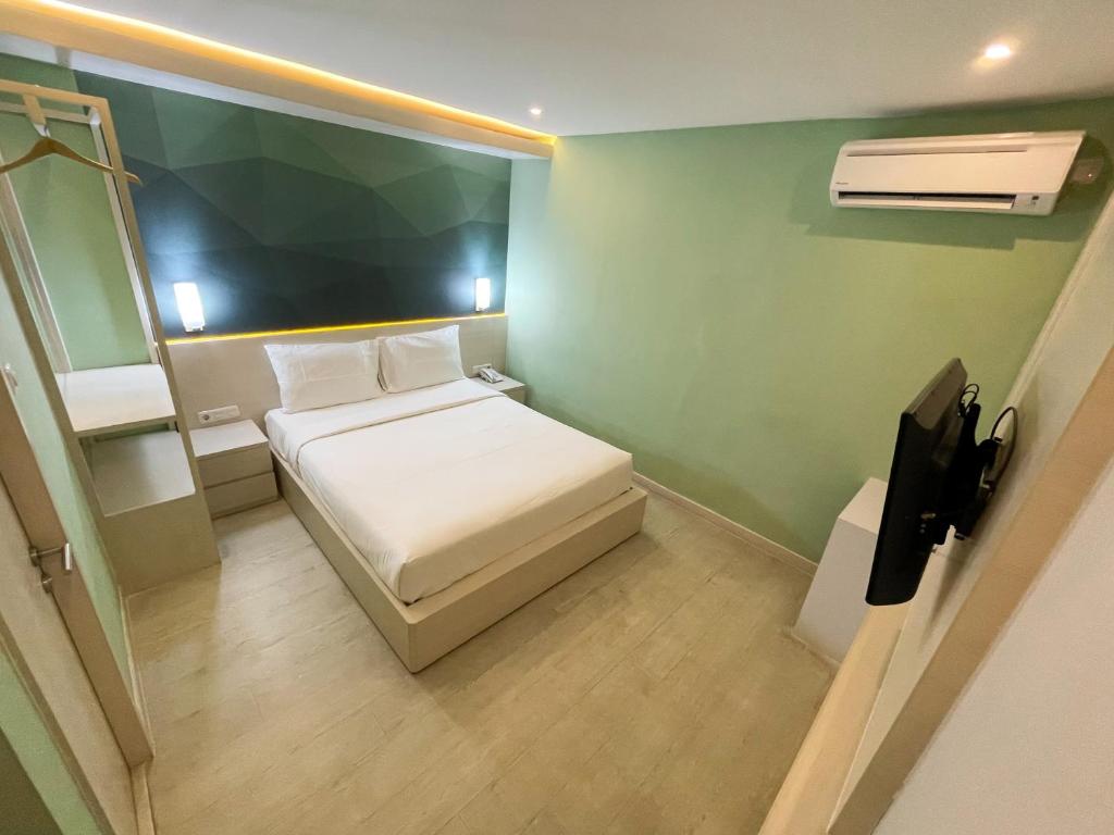 Postel nebo postele na pokoji v ubytování LEAF HoteL