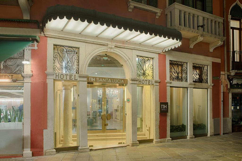 a store front of a building with a large window at NH Venezia Santa Lucia in Venice