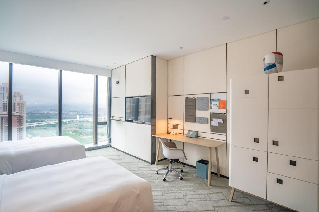 Postel nebo postele na pokoji v ubytování Crowne Plaza Quanzhou Riverview by IHG