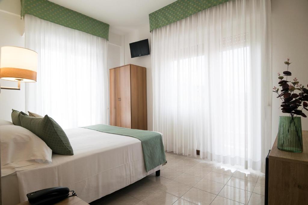 Postel nebo postele na pokoji v ubytování Hotel Pacific