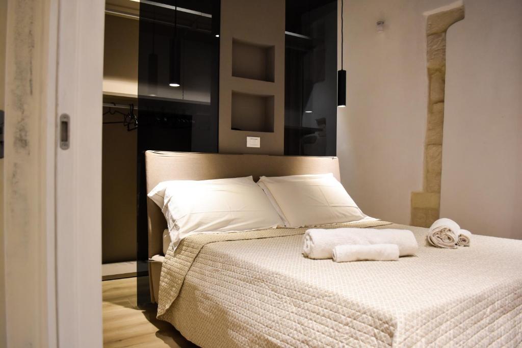 Posteľ alebo postele v izbe v ubytovaní Balcony in Giudecca by Ortigia Apartments