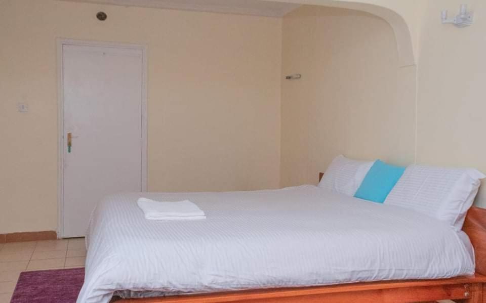 Voodi või voodid majutusasutuse Zoe Homes 3br Mansionette Own Compound Kericho town near Green Square mall toas