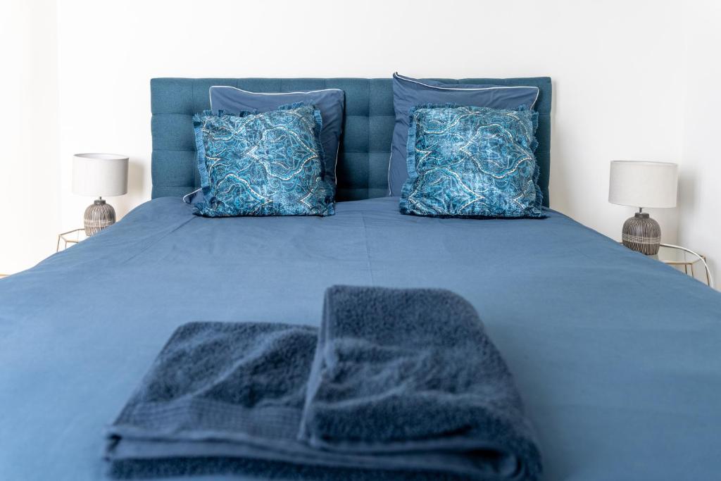 Postel nebo postele na pokoji v ubytování Superbe Appartement F4 Puteaux