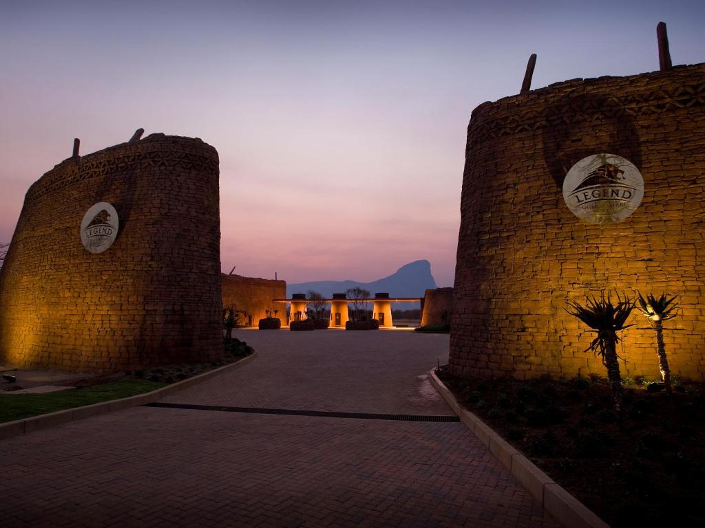 a brick wall with a sunset in the background at Monomotapa Village @ Legend Golf and Safari Resort in Golders Green