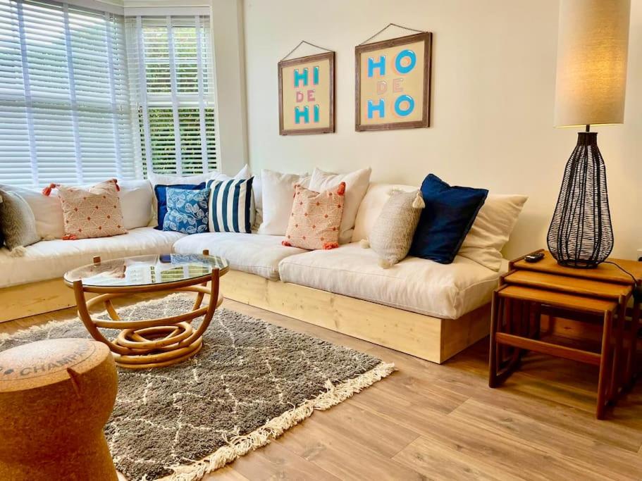 a living room with a couch and a table at Neap Tide in Rye
