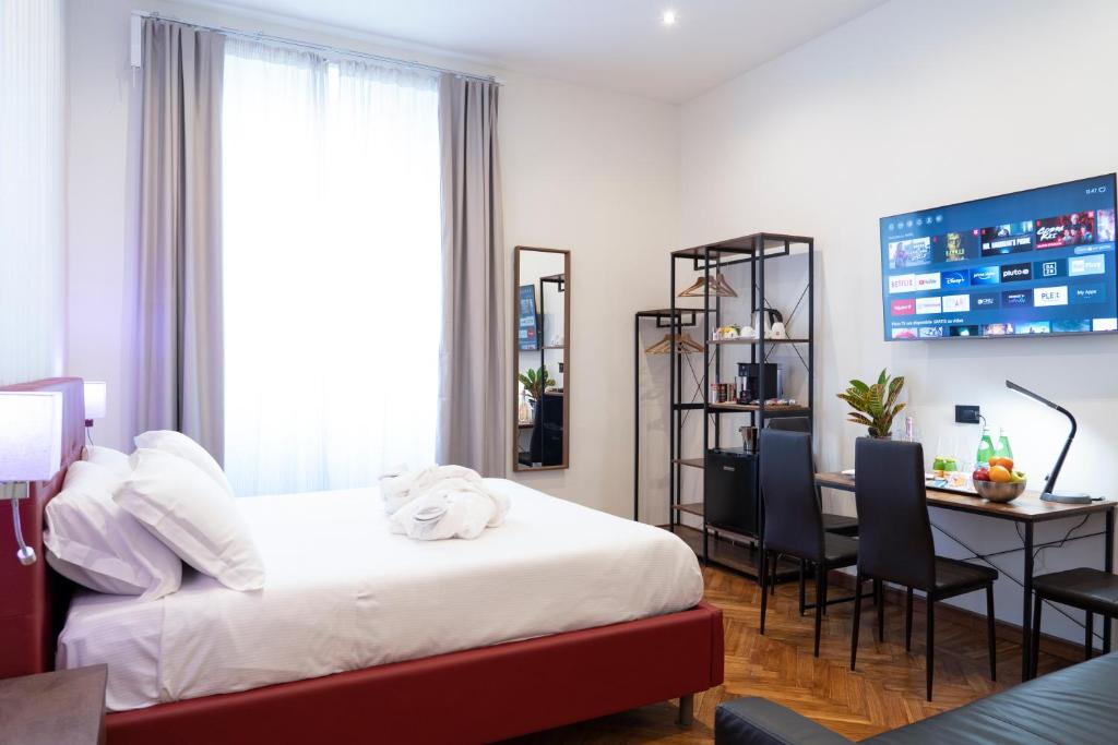 Postel nebo postele na pokoji v ubytování Varese Suites
