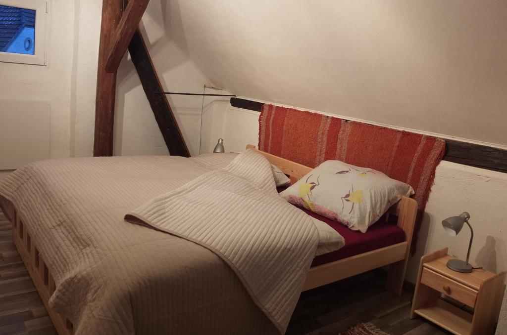 Postel nebo postele na pokoji v ubytování Apartman75