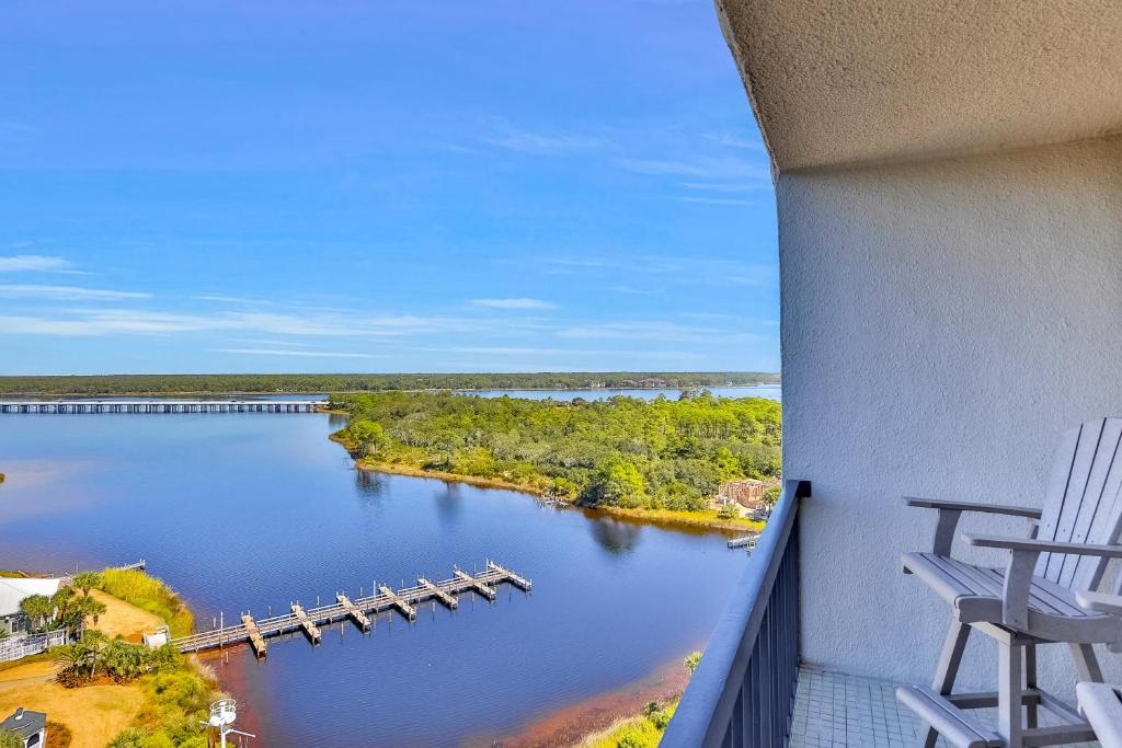 a balcony with a view of a river with a dock at Pinnacle Port Penthouse 10 in Panama City