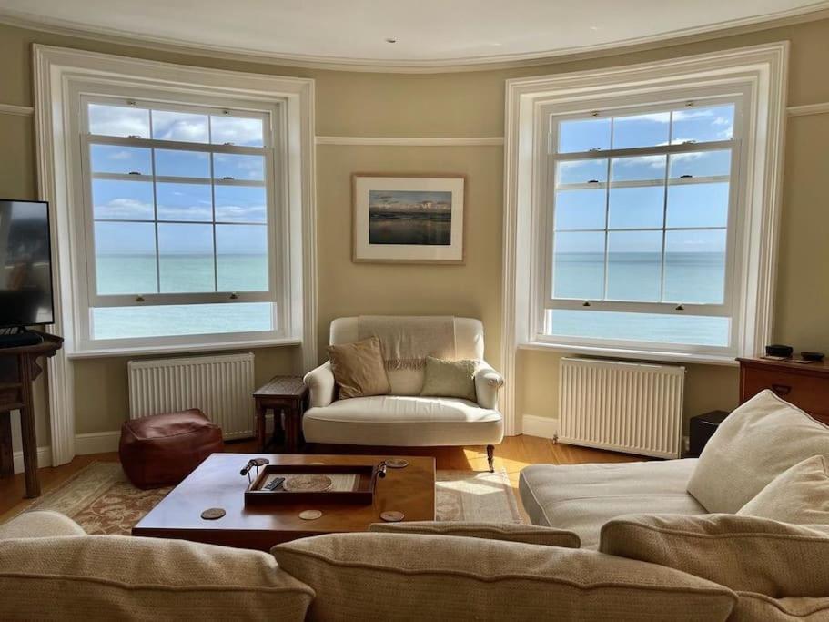 a living room with two couches and two windows at Albion House in Deal