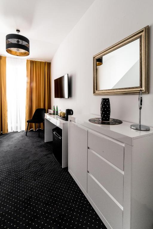 Telewizja i/lub zestaw kina domowego w obiekcie Południk Park Boutique Hotel Conference&SPA