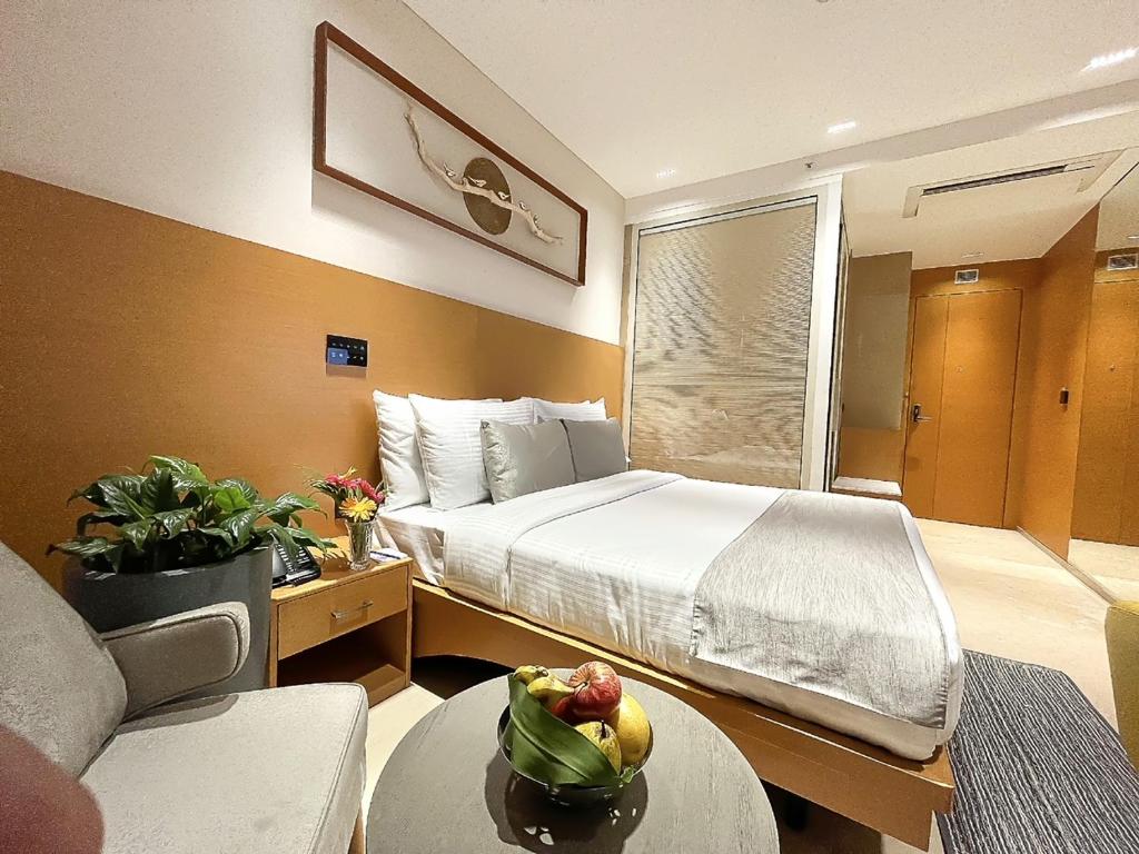 Postel nebo postele na pokoji v ubytování Morvee Hotels Alipore Kolkata