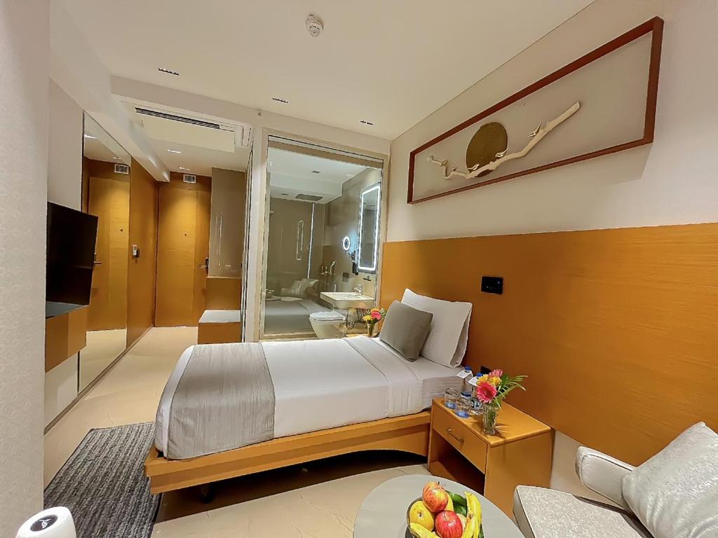Postel nebo postele na pokoji v ubytování Morvee Hotels Alipore Kolkata