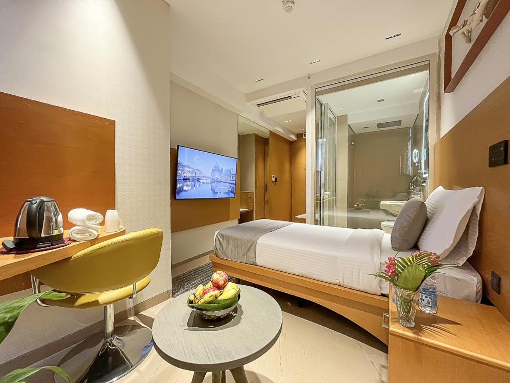 TV a/nebo společenská místnost v ubytování Morvee Hotels Alipore Kolkata
