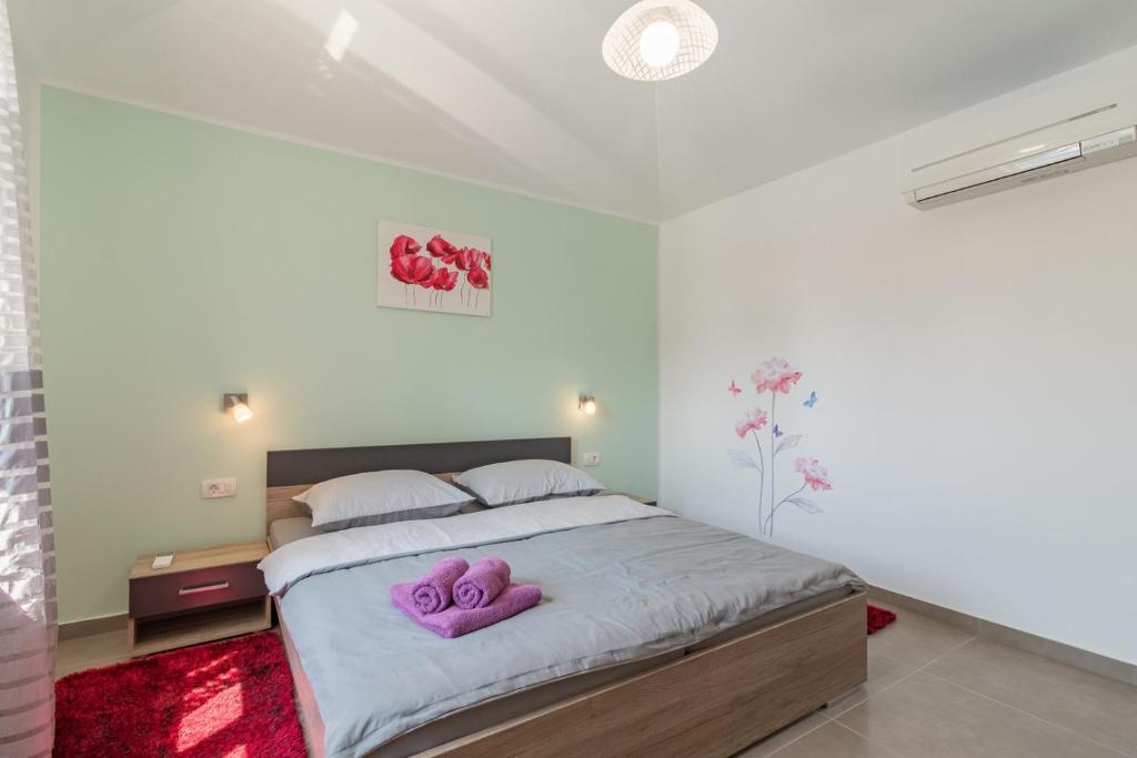Postel nebo postele na pokoji v ubytování Villa Lena