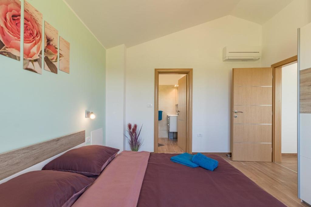 Postel nebo postele na pokoji v ubytování Villa Lena
