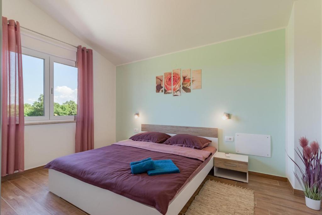 Postel nebo postele na pokoji v ubytování Villa Lena