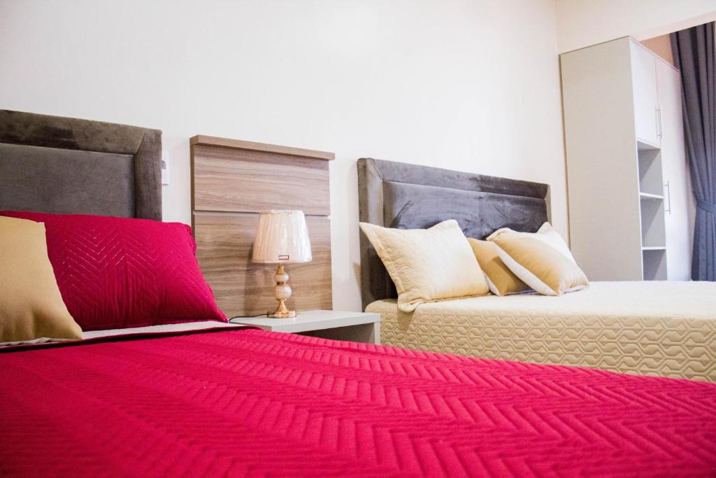 Postel nebo postele na pokoji v ubytování Liebling Hotel Ciudad del Este