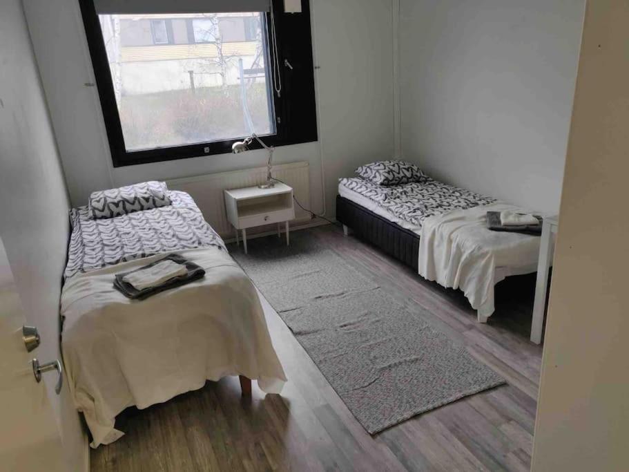 Postel nebo postele na pokoji v ubytování Style 2BR appartment in Tornio city
