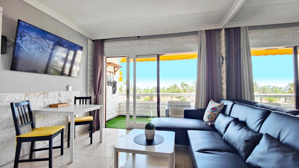 a living room with a couch and a table at Apartment 2-2 Playa del Ingles in Playa del Ingles