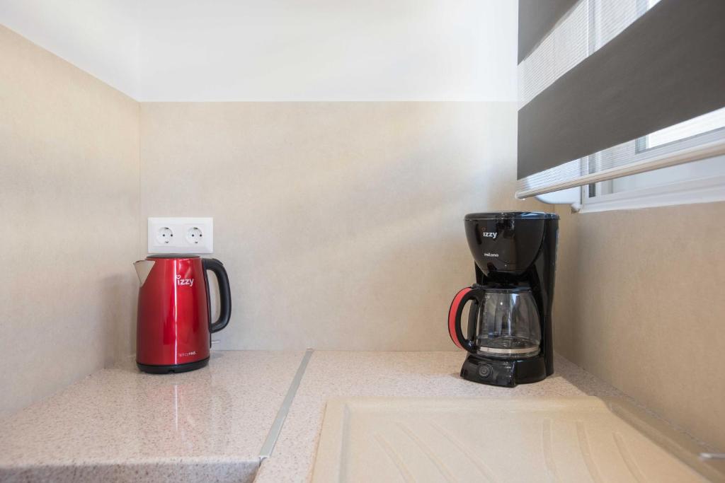 Coffee and tea making facilities at Comfy Central 1 Bedroom Apt with Terrace and View