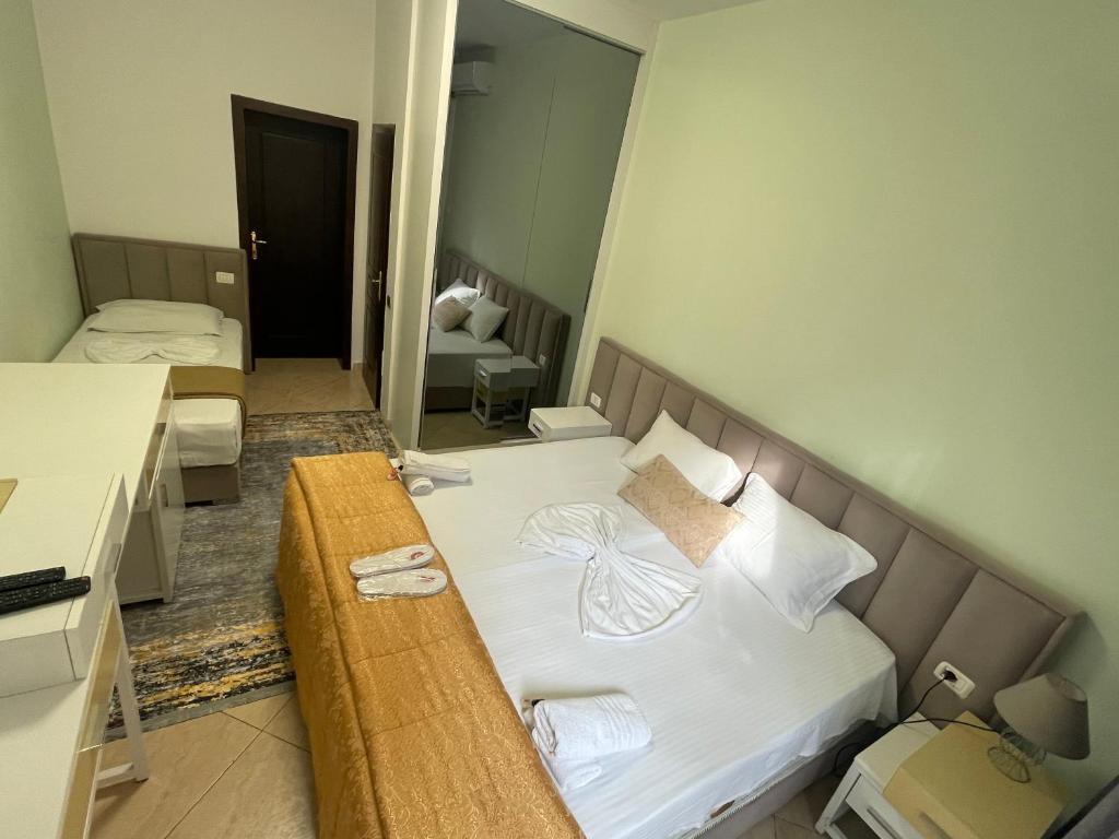 Postel nebo postele na pokoji v ubytování VILA SANREMO