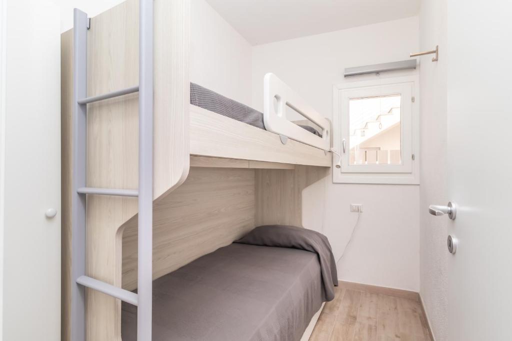 Łóżko lub łóżka w pokoju w obiekcie Stella Marina beach house