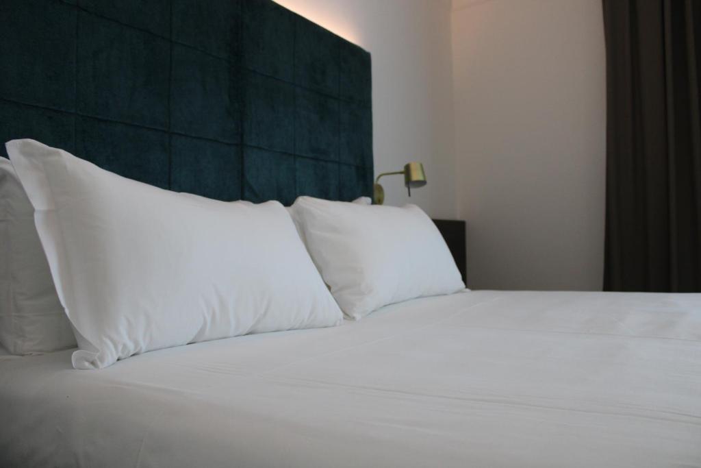 Posteľ alebo postele v izbe v ubytovaní Park Hotel Junior
