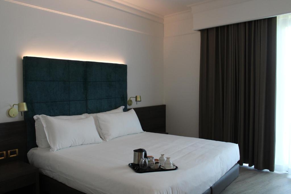 Posteľ alebo postele v izbe v ubytovaní Park Hotel Junior