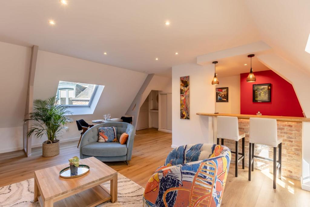 a living room with a couch and a table at Soft time - Luxury flat - Historic Centre Honfleur in Honfleur