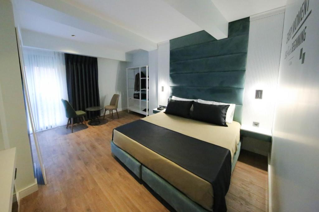 Postel nebo postele na pokoji v ubytování AXU AIRPORT HOTEL