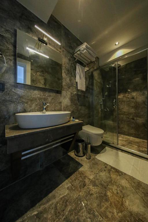 Koupelna v ubytování AXU AIRPORT HOTEL