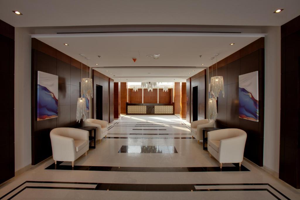 a hallway with chairs and a waiting room at The Rester Hotel in Kuwait