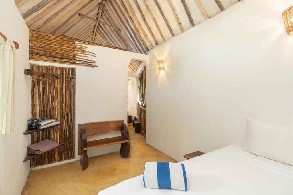Postel nebo postele na pokoji v ubytování Yaxchen Tulum Cabañas & Cenote
