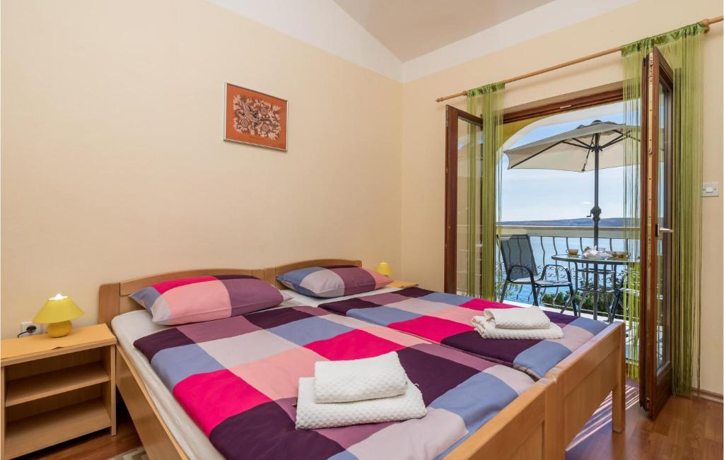 Posteľ alebo postele v izbe v ubytovaní Cozy Apartment In Lukovo Sugarje