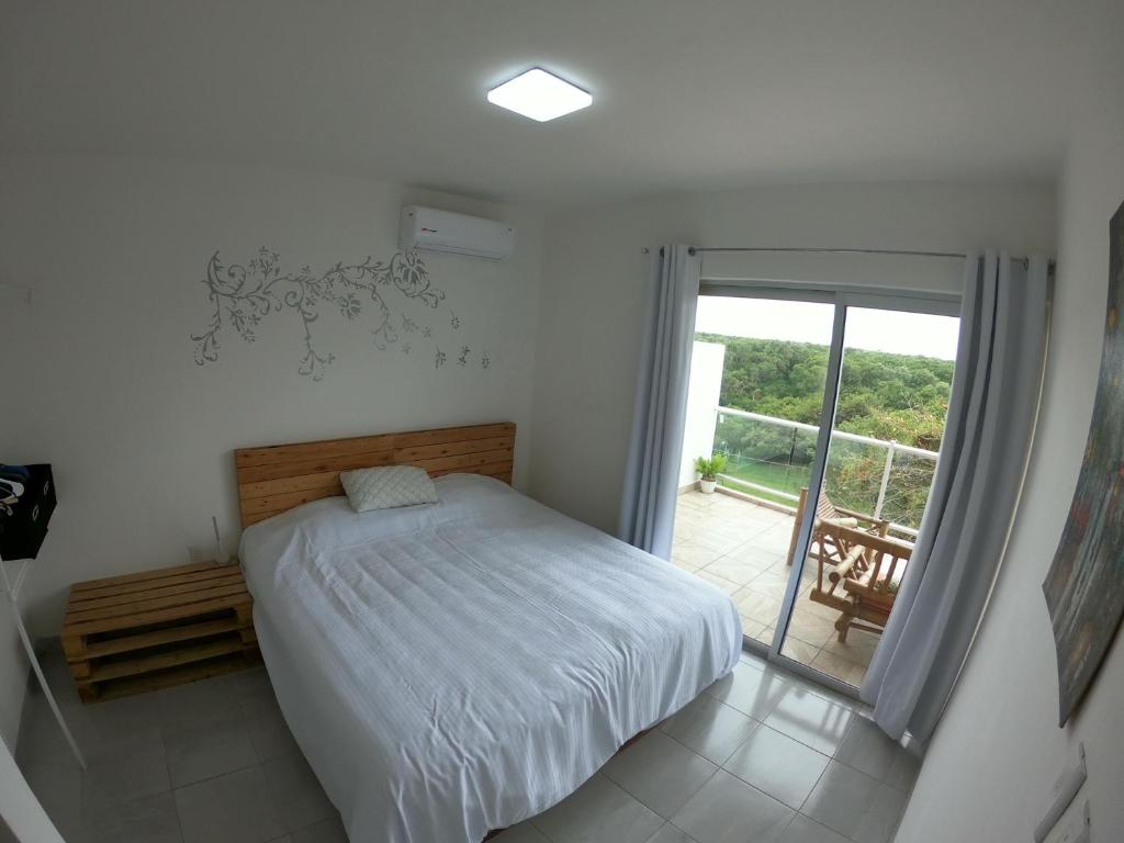 Postel nebo postele na pokoji v ubytování Boca PentHouses - Tampiquera