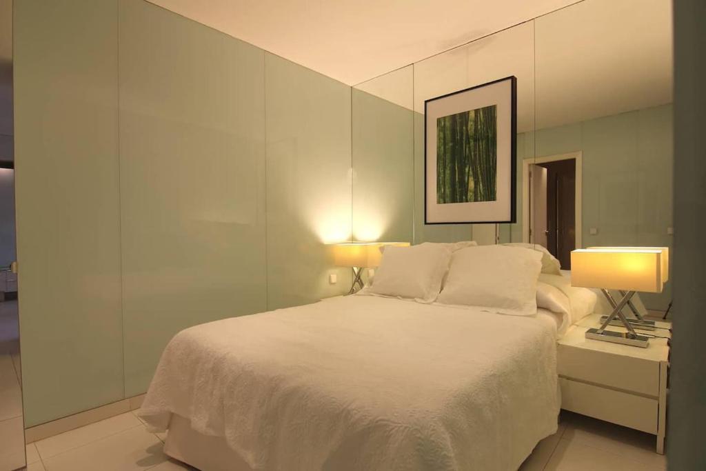 A bed or beds in a room at Apartamento Gran Via IV -Quinto Piso Sin Ascensor-