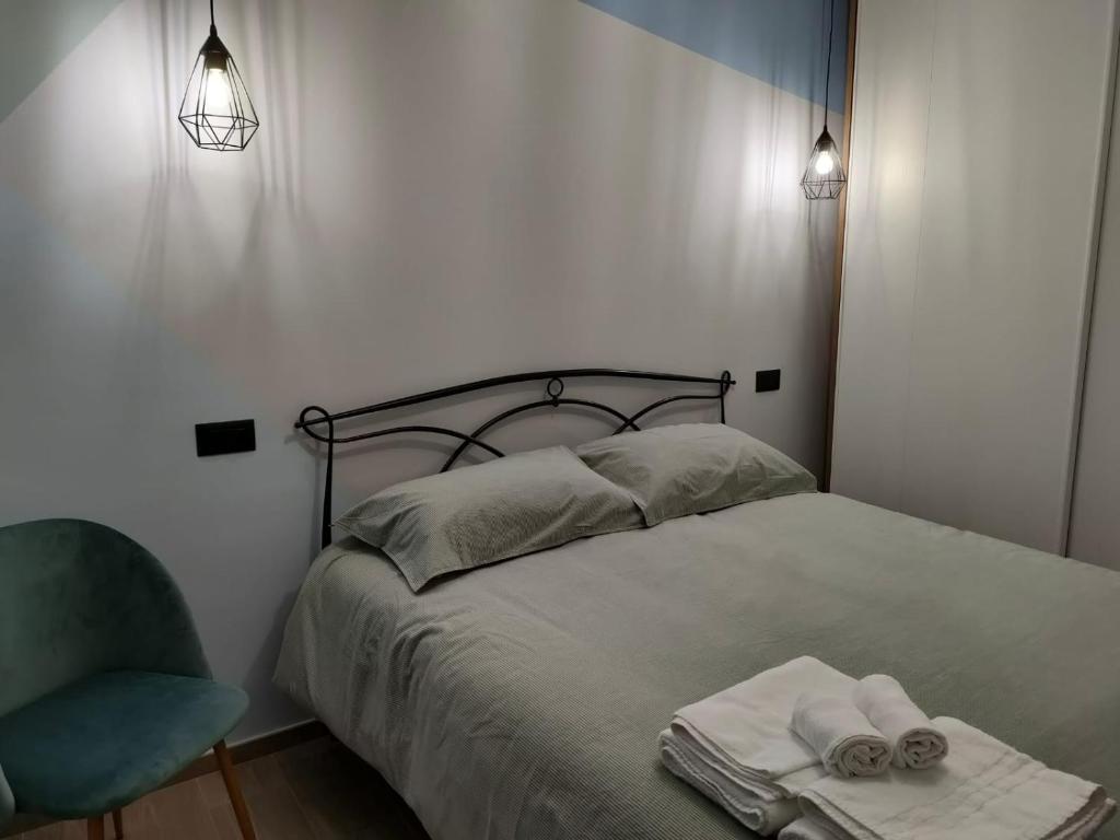 Łóżko lub łóżka w pokoju w obiekcie La Petite Maison