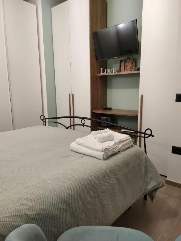 Łóżko lub łóżka w pokoju w obiekcie La Petite Maison