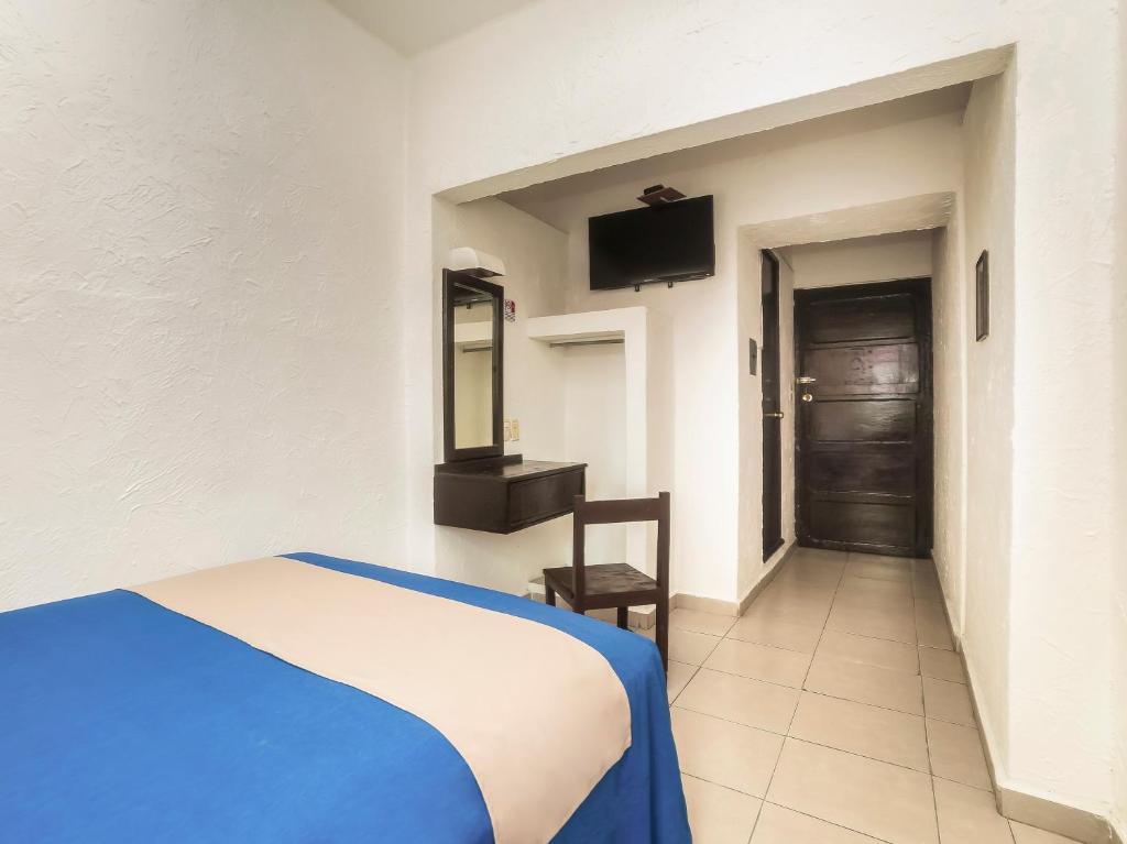 Postel nebo postele na pokoji v ubytování Hotel Trianon