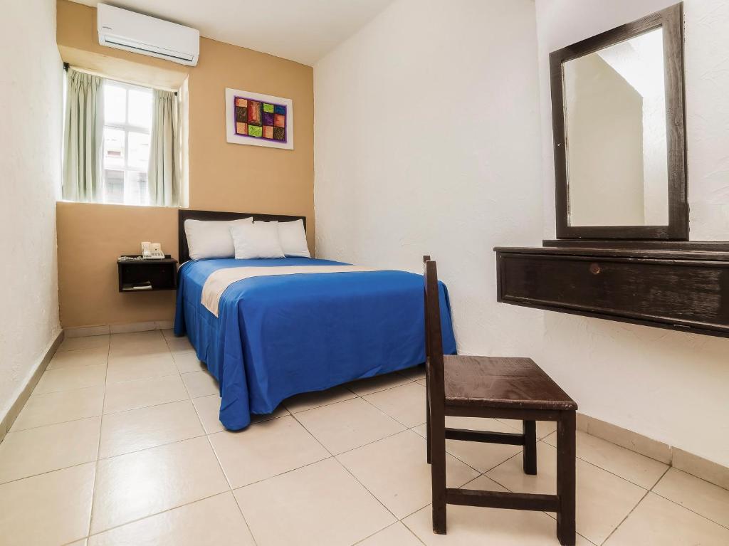 Postel nebo postele na pokoji v ubytování Hotel Trianon