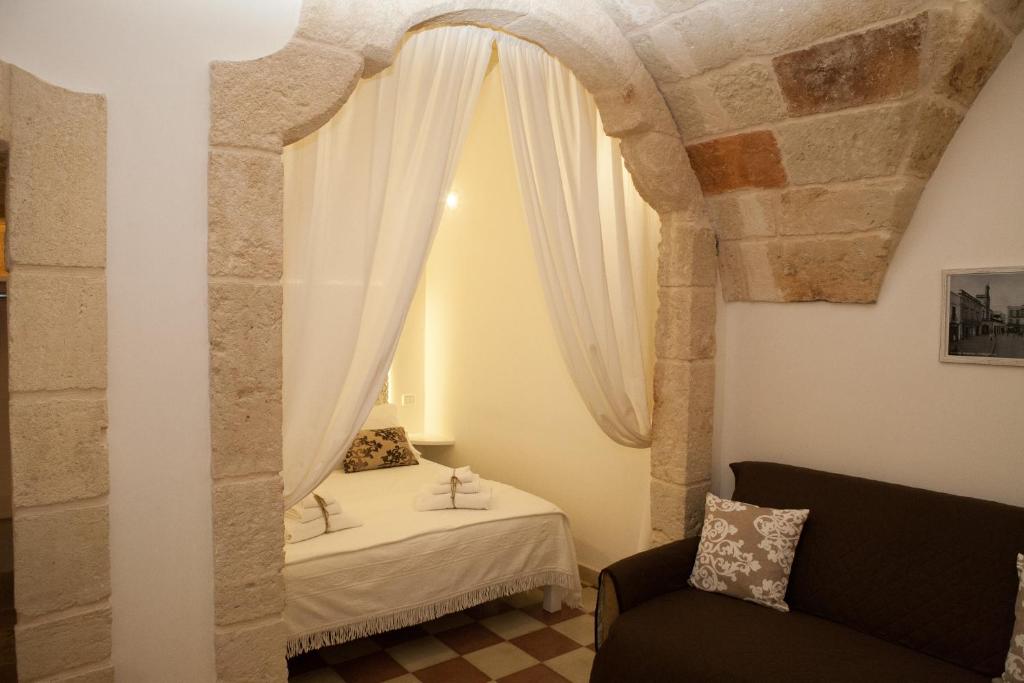 Postel nebo postele na pokoji v ubytování La Casa nel Borgo