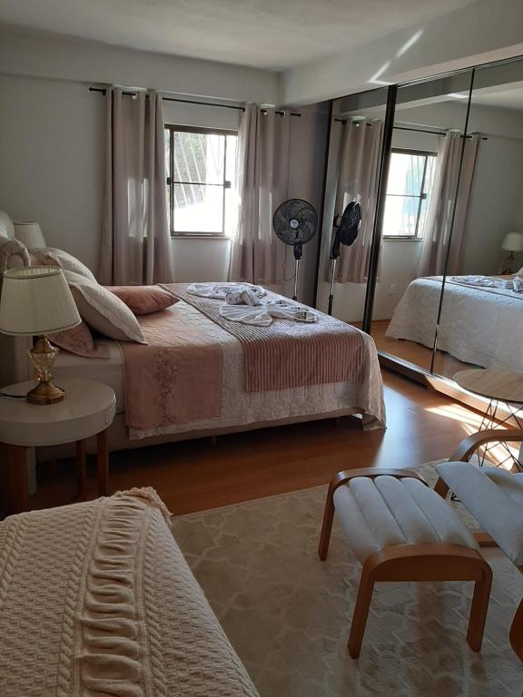 Ένα ή περισσότερα κρεβάτια σε δωμάτιο στο Casa Schmidt Centro Pedra Azul