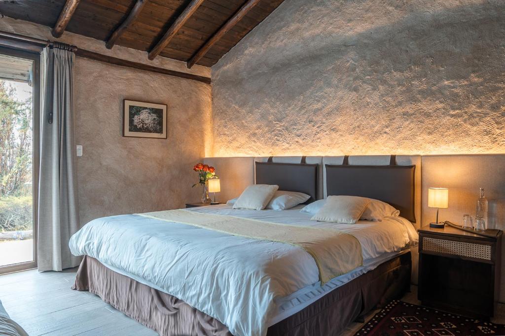 Postel nebo postele na pokoji v ubytování Chilcabamba Lodge