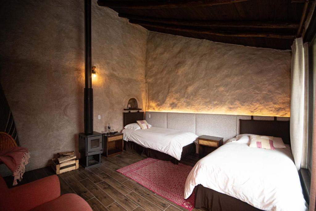 Postel nebo postele na pokoji v ubytování Chilcabamba Lodge