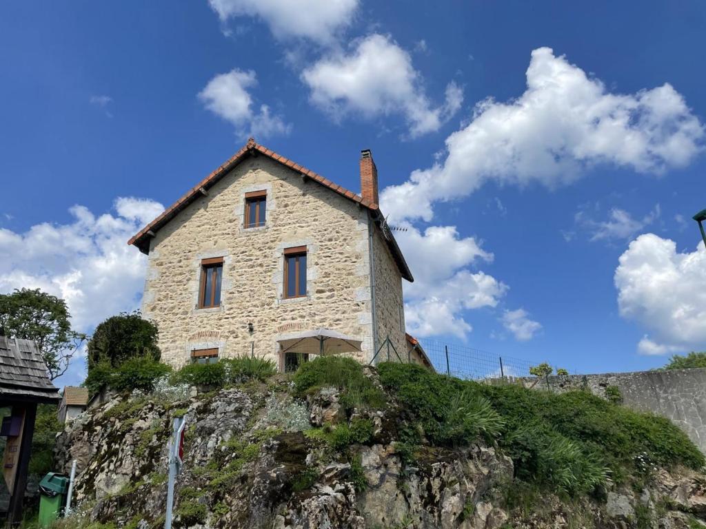 a house on top of a mountain at Maison rénovée avec jardin, BBQ, animaux acceptés - FR-1-489-341 in La Chabanne