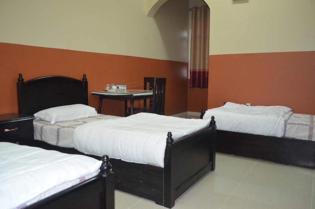 Postel nebo postele na pokoji v ubytování Five Continents Hotel
