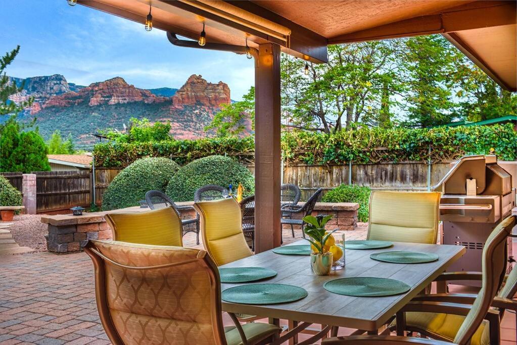 a table and chairs with a view of the grand canyon at PRIME Uptown Location- Mountain View- Kid Friendly - Sleeps 10 in Sedona