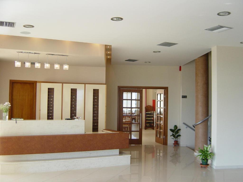 Postel nebo postele na pokoji v ubytování Achillio Hotel